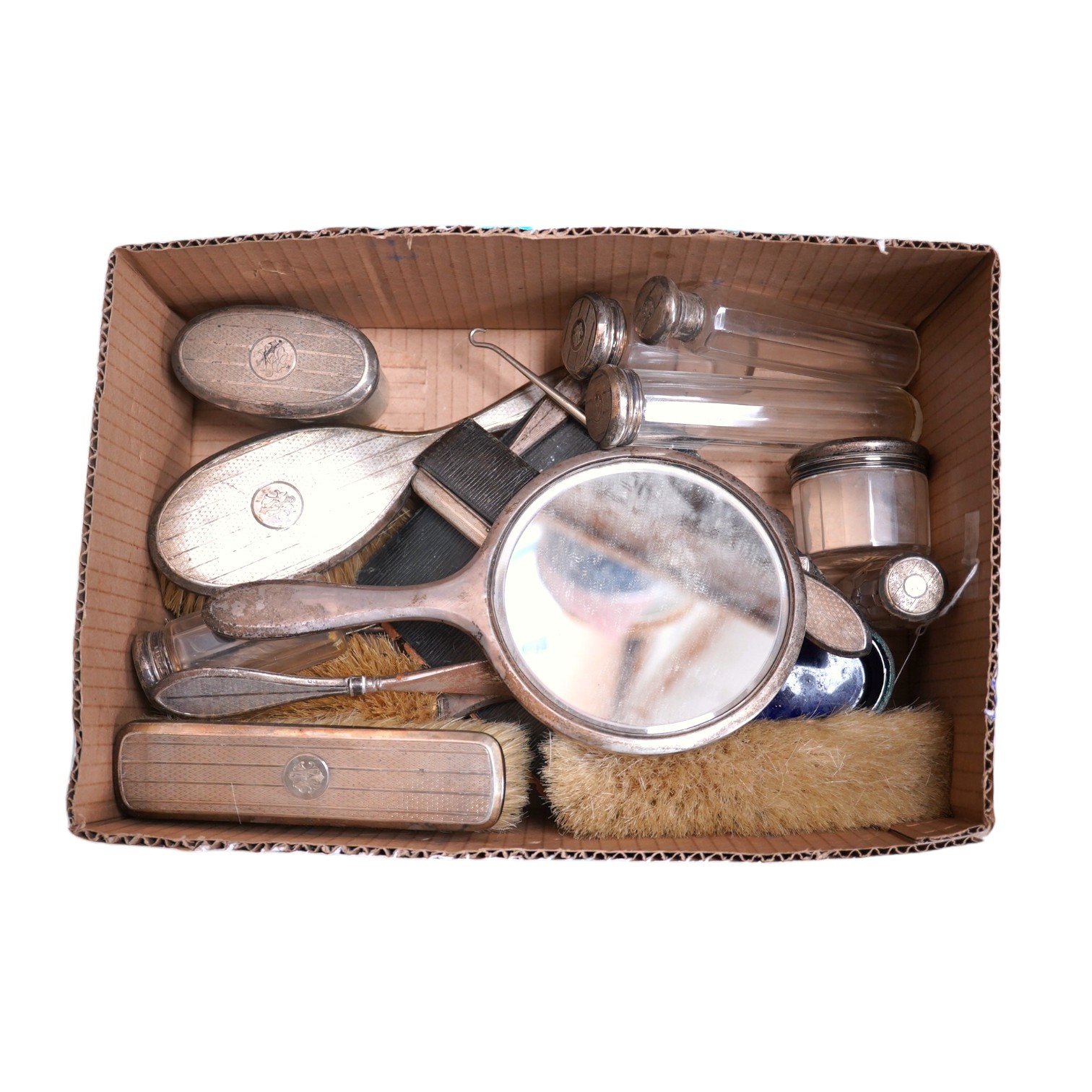 Fourteen silver mounted toilet jars, brushes, mirror, comb etc, together with a pair of glass handled silver salad servers and a silver salt. Condition - poor